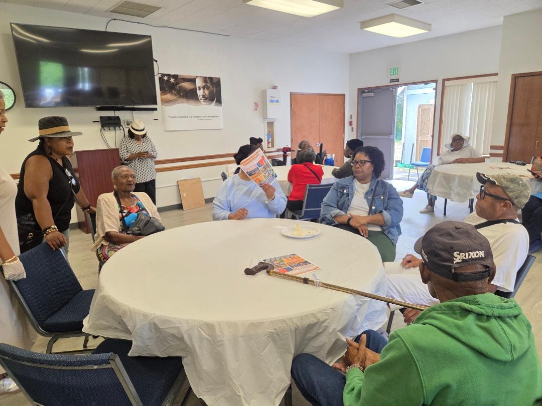 Church family seated at round tables enjoying fellowship at the Church BBQ 2026 — MLK Memorial Baptist Church