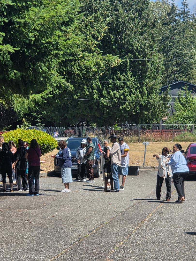 Church members gathering in the parking lot for outdoor activities at the Church BBQ 2026 — MLK Memorial Baptist Church