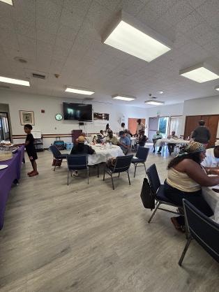 Church members gathered in the fellowship hall at the Church BBQ 2026 — MLK Memorial Baptist Church