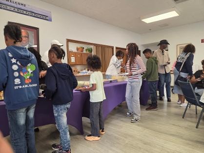Youth and families gathered at the buffet line at the Church BBQ 2026 — MLK Memorial Baptist Church