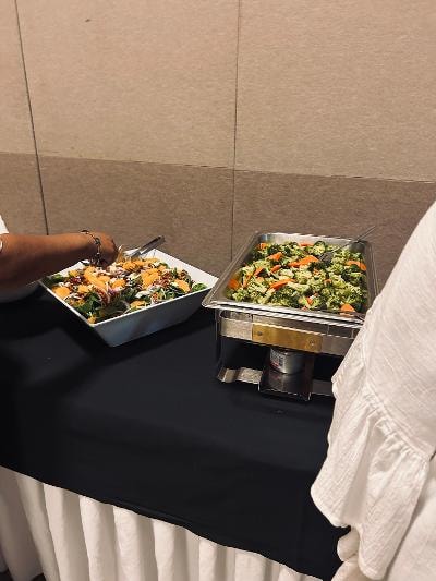 Catered salad dishes on buffet table at the Golden Jubilee All-White Affair
