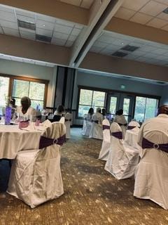 Banquet hall venue setup with white draped chairs and purple accents at the Golden Jubilee All-White Affair — MLK Memorial Baptist Church 2026