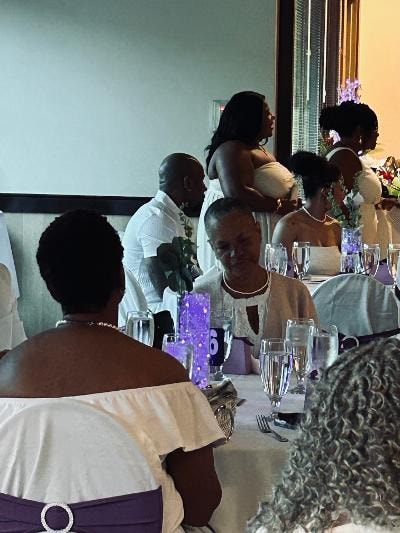 Church family gathered at dinner tables in white attire at the Golden Jubilee All-White Affair — MLK Memorial Baptist Church 2026