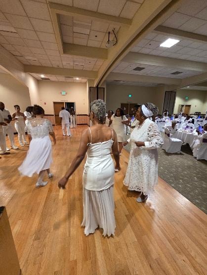 Guests in white attire dancing at the Golden Jubilee All-White Affair 2026