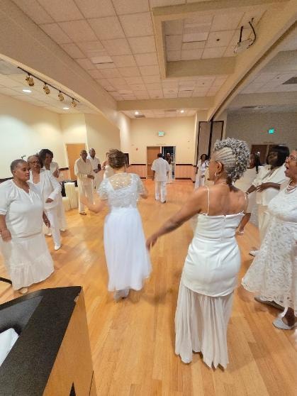 Guests celebrating and dancing at the Golden Jubilee All-White Affair 2026