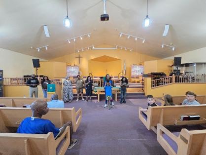 Church interior during VBS assembly — Day 1