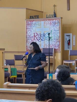 Speaker at the front of the sanctuary — VBS Day 1