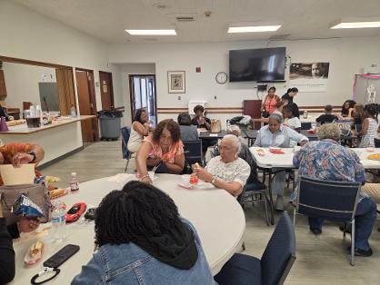 Fellowship dinner — members seated at tables VBS Day 1
