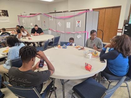 Fellowship dinner — children and adults at tables VBS Day 1