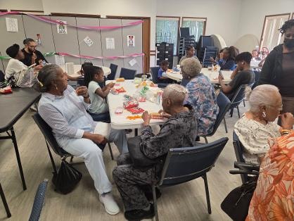 Fellowship dinner — members seated in fellowship hall VBS Day 1