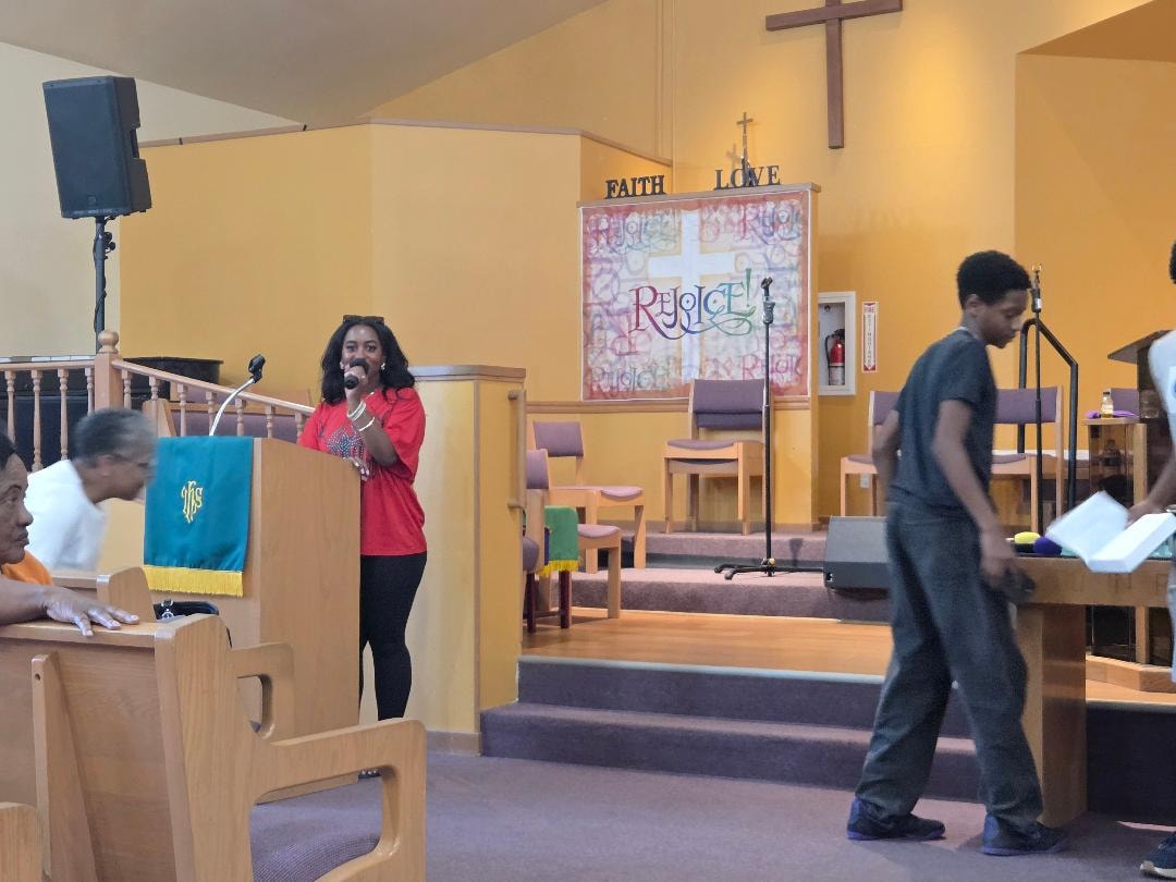 Kassie and youth group on stage with congregation watching — VBS Day 3 Assembly, MLK Memorial Baptist Church