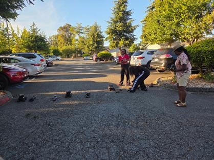 Children playing with toy cars in parking lot — VBS Day 3 Assembly