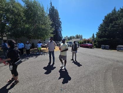 Children running in parking lot during outdoor activity — VBS Day 3 Assembly