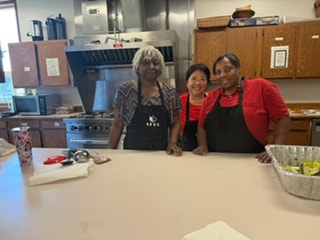 Laura, Sherry and Truniere in the kitchen — VBS 2026 MLK Memorial Baptist Church