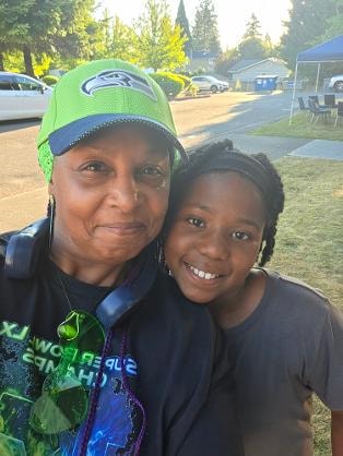 Purple and Graves Baby smiling together outdoors — VBS 2026 MLK Memorial Baptist Church