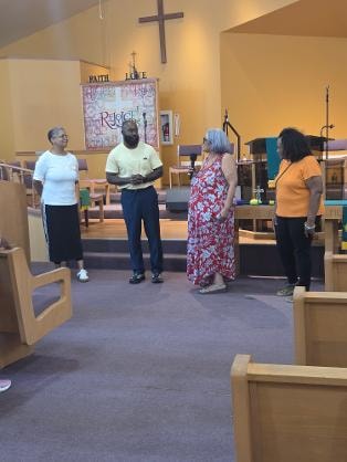 Teachers gathered in the sanctuary — VBS 2026 MLK Memorial Baptist Church